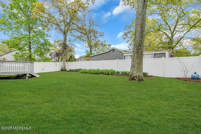 Yard is professionally maintained. | Image 35