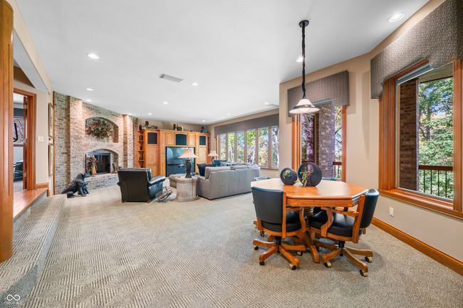 carpeted dining room with baseboards, recessed lighting, visible vents, and a fireplace | Image 72