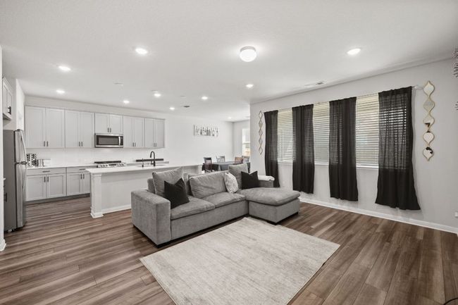 Living room featuring visible vents, wood finished floors, and recessed lighting | Image 7