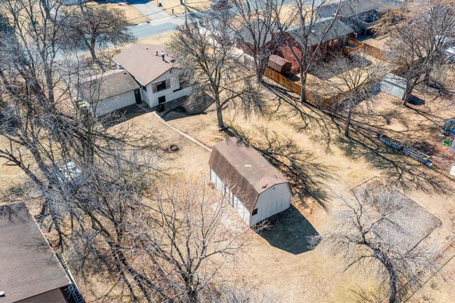 An aerial view of the home, yard, and surrounding area. | Image 20