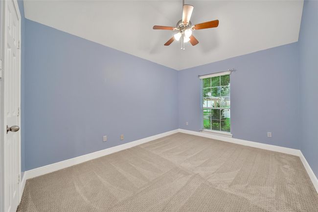 The secondary bedrooms are spacious and bright with generous closet space. | Image 22