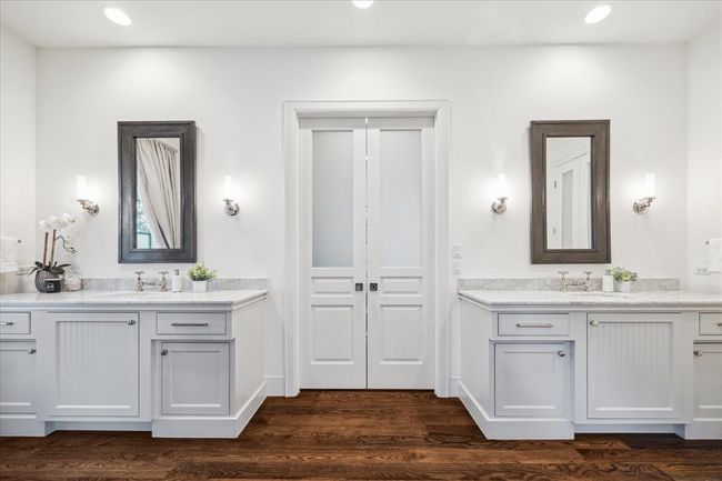 PRIMARY BATHROOM. Doors to the closet | Image 18