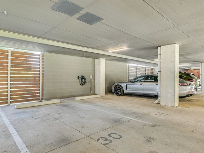 You also get 2 side-by-side reserved garage parking spaces (30 & 31), equipped with your very own EV charging station...Wow! | Image 28
