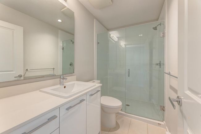 Full bathroom with vanity, tile patterned flooring, a shower stall, and recessed lighting | Image 32