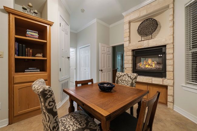 As part of the primary suite of rooms, this sitting room is the perfect place to play a game, read a book, or it could be used as a second office. | Image 10