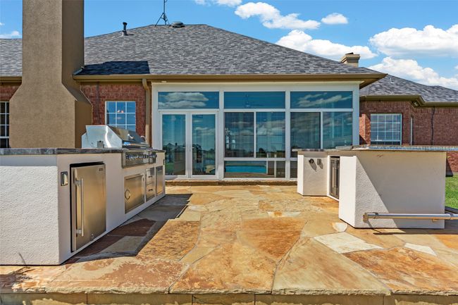 OUTDOOR KITCHEN...Offers 2 Fridges, Built-In Sound And Gas Grill | Image 13