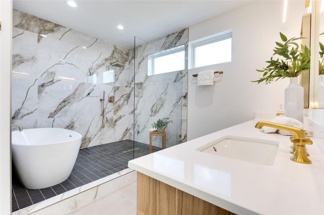 Bathroom with independent shower and bath, vanity, and tile patterned flooring | Image 25