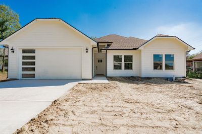 Single story home with a garage | Image 2