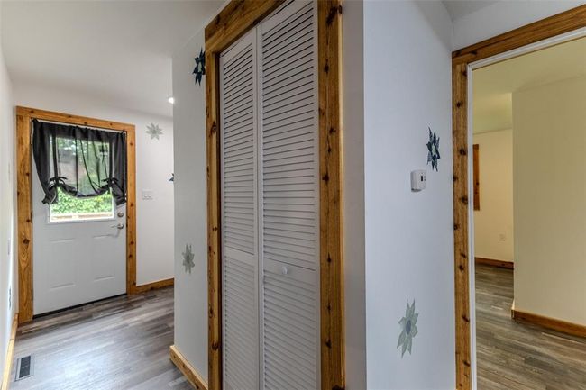 Hallway with wood finished floors and baseboards | Image 30