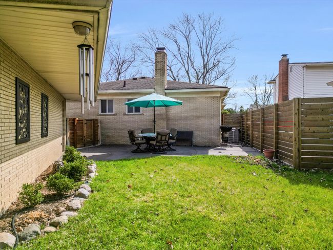 Fully fenced yard with patio | Image 19