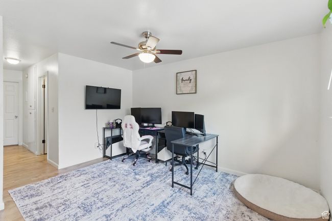 Office with baseboards, wood finished floors, and ceiling fan | Image 25