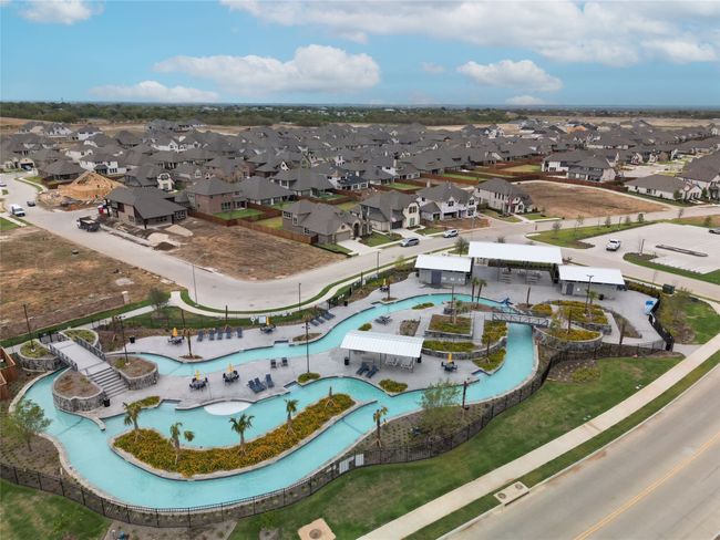 View of property location with a pool area and nearby suburban area | Image 36