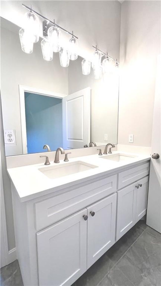 This bathroom serves the main level next to the second bedroom. | Image 31