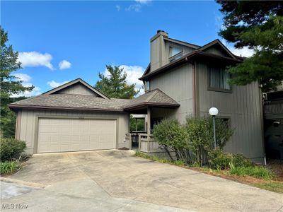 View of front of house featuring a garage | Image 1