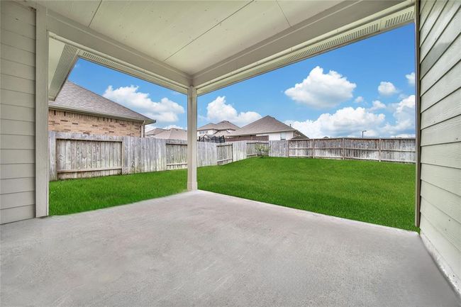 We told you it was a great size covered patio. | Image 10
