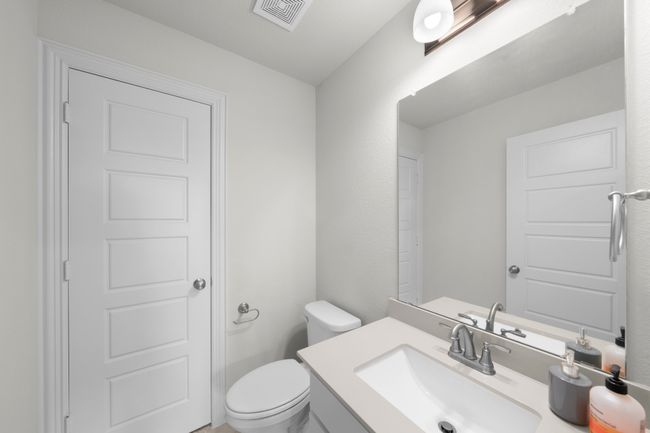 Bathroom featuring vanity and toilet | Image 17