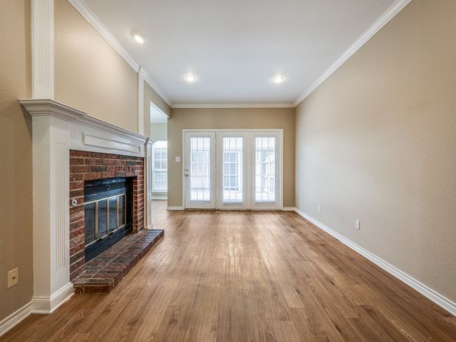 Living room has French doors that led to patio and garage. | Image 6