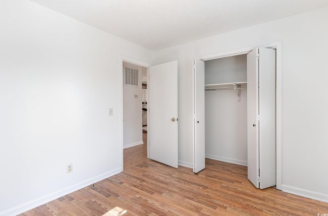Unfurnished bedroom featuring light hardwood / wood-style floors and a closet | Image 18