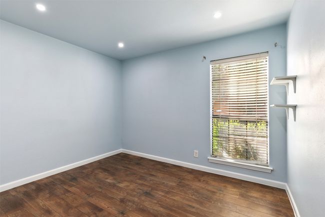 Empty room with hardwood / wood-style flooring, baseboards, and recessed lighting | Image 12