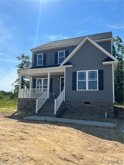 View of front of home with a porch | Image 1