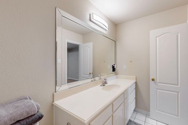 Bathroom featuring tile patterned floors and vanity | Image 26