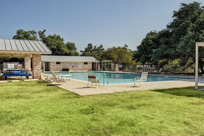 Community pool with a patio area | Image 35