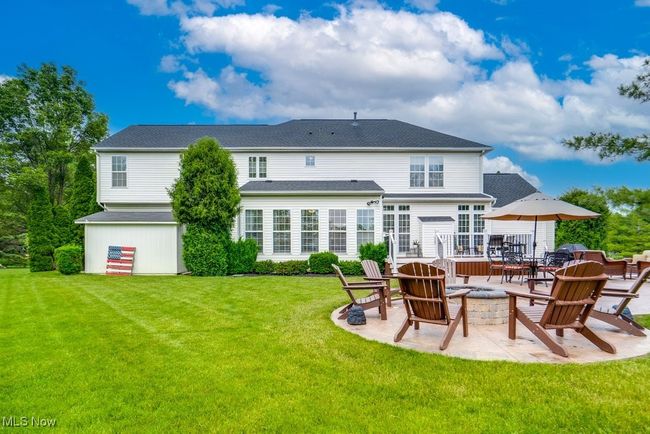 Back of property with a fire pit, a patio, and a yard | Image 39