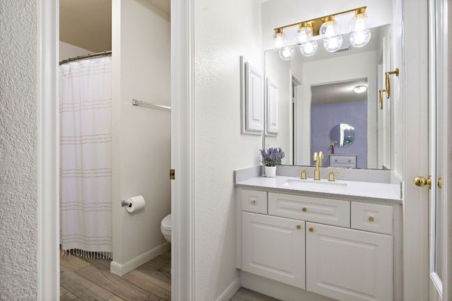 Full upstairs bath includes 2 separate vanity areas for added utility | Image 29