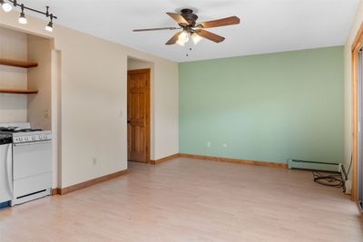 Open living room/kitchen with plentiful natural light and great mountain views! | Image 3