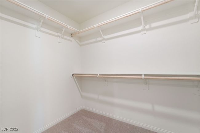 Spacious closet with carpet flooring | Image 25