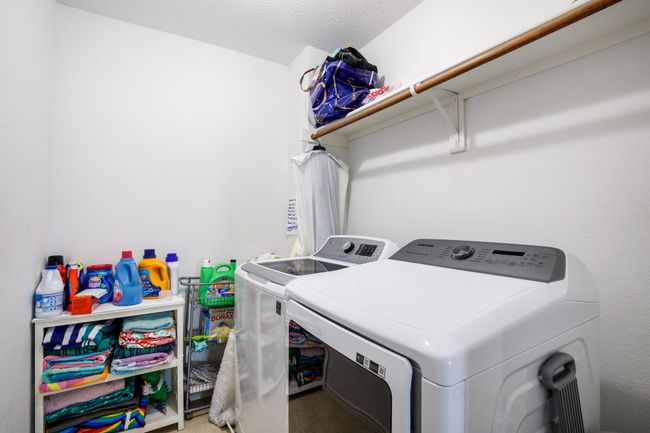Washroom featuring washing machine and dryer | Image 18
