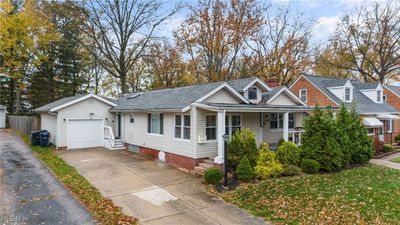 View of front of house featuring a garage and covered porch | Image 2