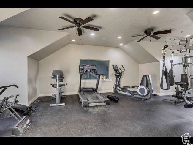 Workout area with a ceiling fan, recessed lighting, baseboards, and lofted ceiling | Image 15