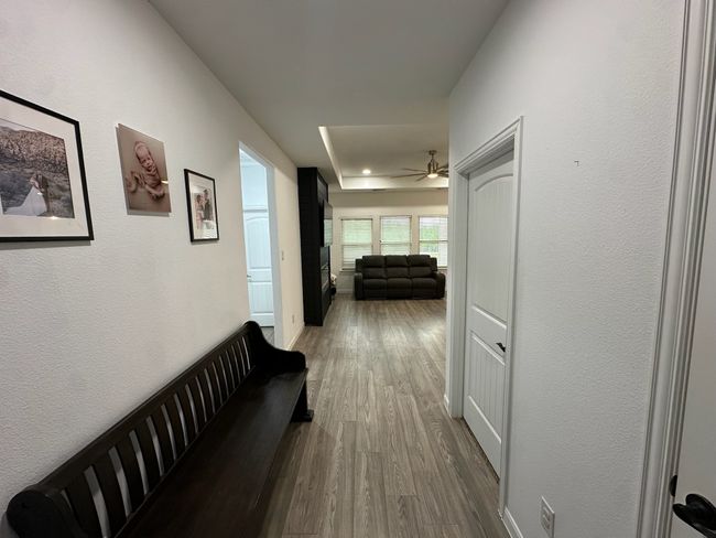 Bedroom featuring carpet, a ceiling fan, recessed lighting, and a tray ceiling | Image 16