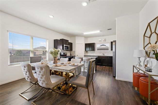 Dining room with dark wood-style floors, baseboards, and recessed lighting | Image 11