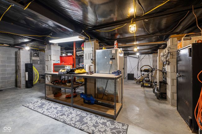 unfinished below grade area featuring a workshop area | Image 36