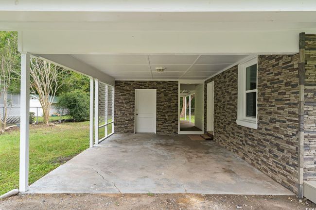 View of patio with an attached carport | Image 9
