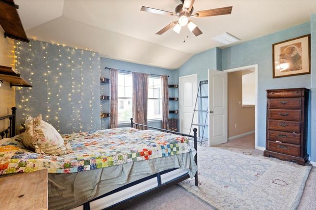 Spacious primary bedroom boasting natural light. | Image 21