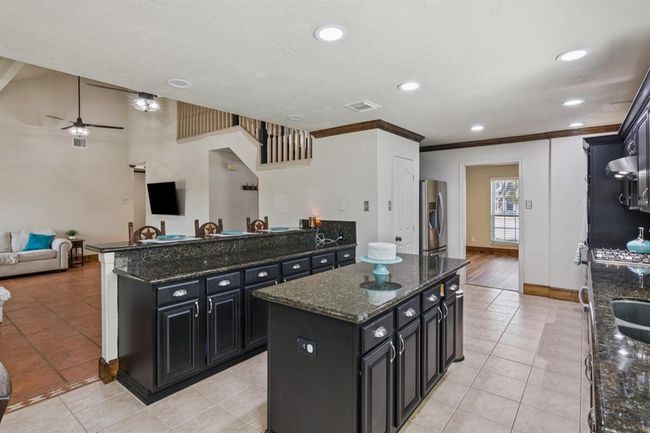 Center island with lots of storage. Walk in pantry | Image 12