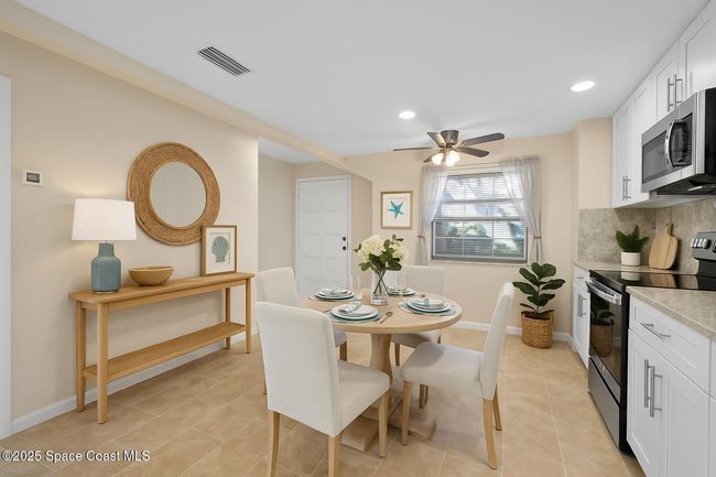 (Virtually staged) Kitchen and breakfast nook | Image 17