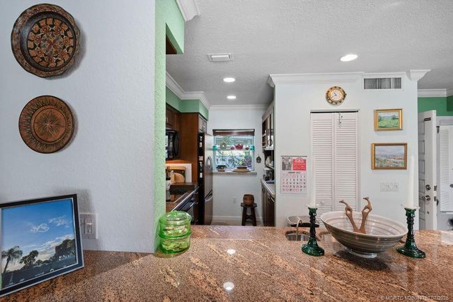Looking into kitchen from bar | Image 13