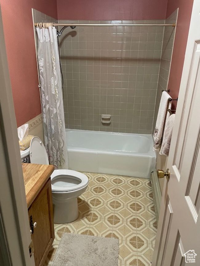 Bathroom featuring shower / tub combo, toilet, and vanity | Image 14