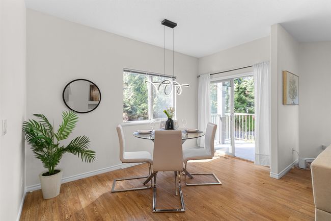 Dining area with wood finished floors and baseboards | Image 13