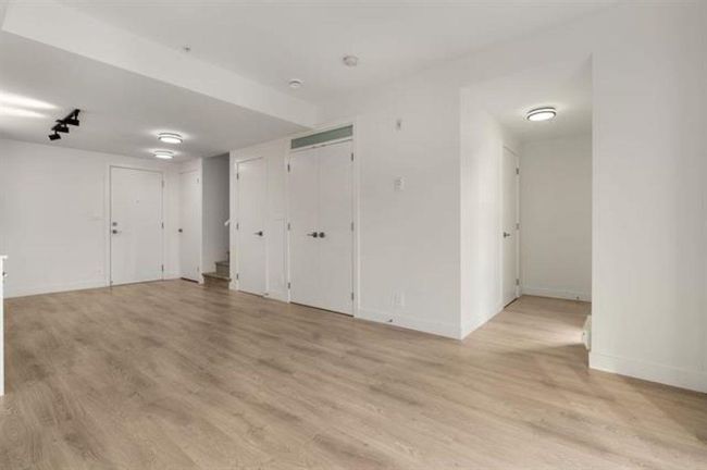 Spare room featuring baseboards and light wood finished floors | Image 10