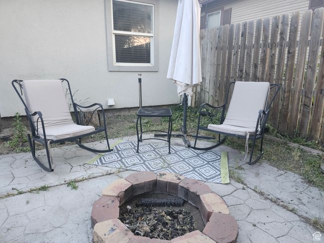 View of patio with an outdoor fire pit | Image 23