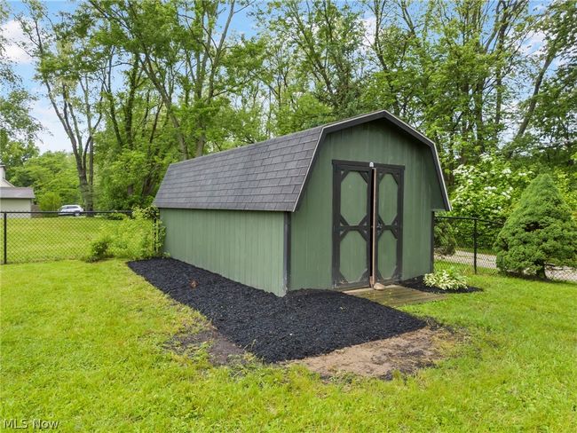 View of outdoor structure featuring a lawn | Image 29