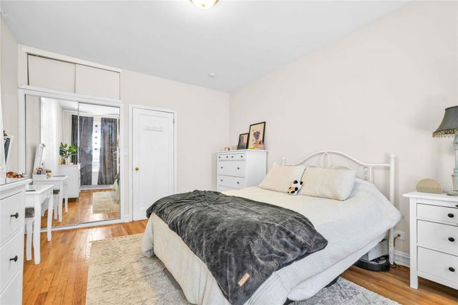 Bedroom featuring light wood finished floors | Image 11