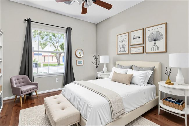 Cozy and inviting, Bedroom 2 features abundant natural light, elegant decor, and ample space for relaxation. | Image 26