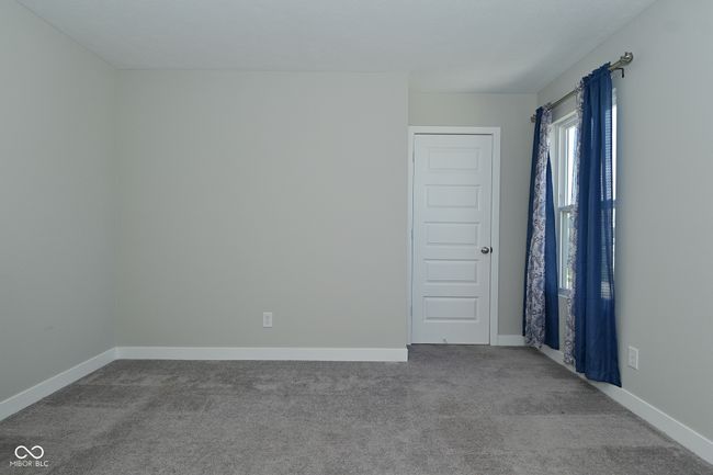 carpeted empty room with baseboards | Image 31