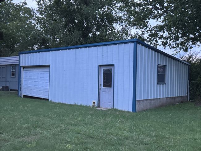 View of outdoor structure featuring a garage | Image 22